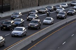 three lanes of traffic on highway