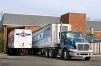 Trucks parked outside a warehouse