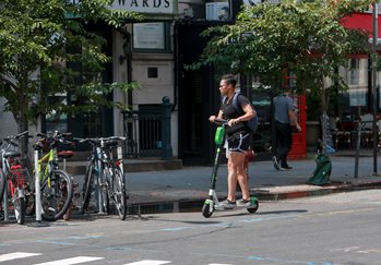 A person rides an electric scooter.