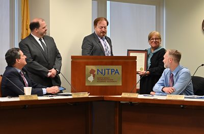 NJTPA Executive Director and Chair John W. Bartlett present former Chair Kathryn A. DeFillippo a resolution for years of service