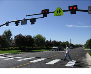 A pedestrian crosses at an intersection